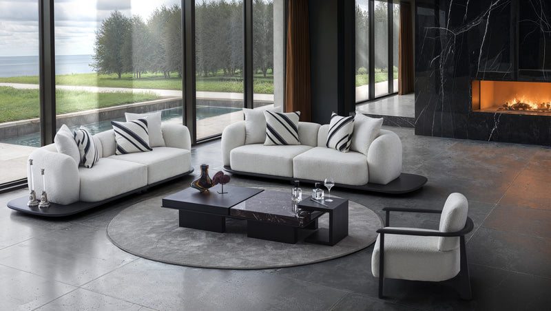 Sorell Armchair — in a living room with light seating and dark occasional tables