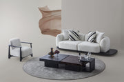 Sorell Armchair — beside the sofa and tables in a neutral room setting