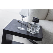 Sorell Side Table — close view of the compact dark side surface beside upholstery