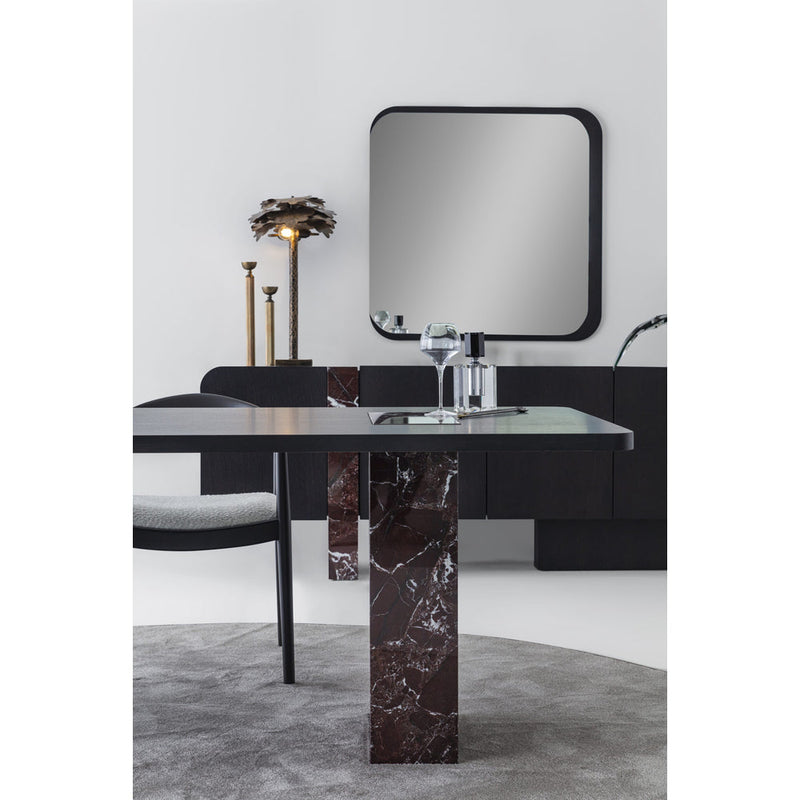 Sorell Sideboard and mirror behind a coordinating dining table