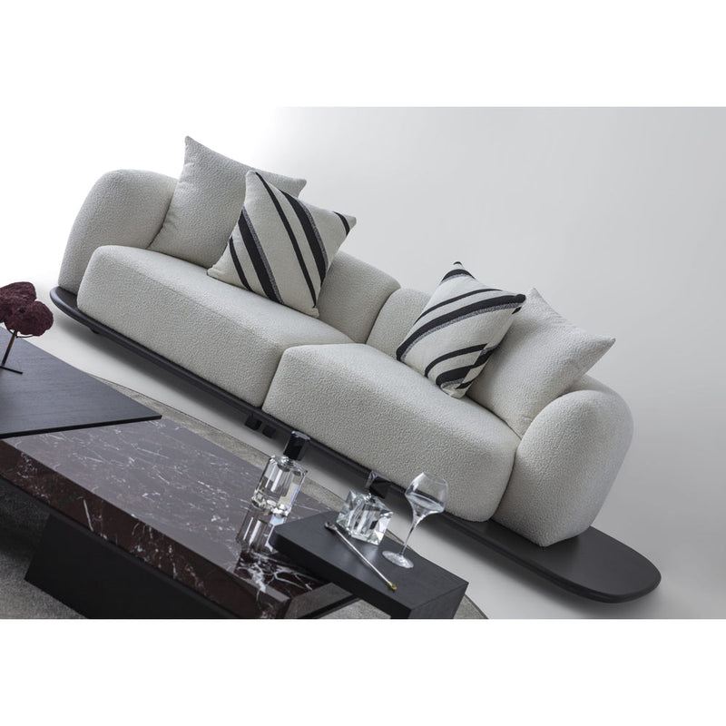Sorell Sofa — angled view of the rounded cushions and dark platform